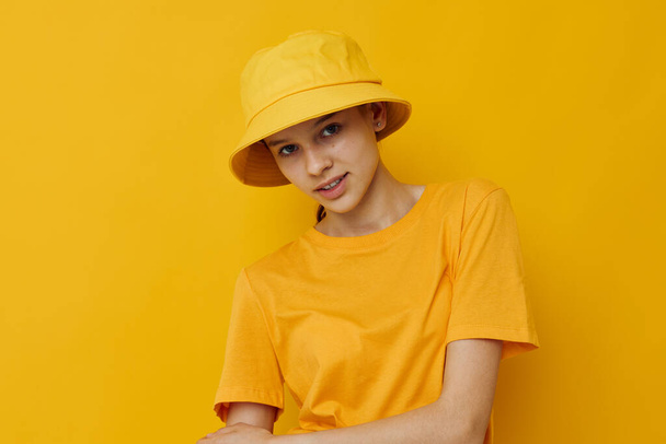 optimistic young woman in a yellow hat Youth style casual wear isolated background - Фото, зображення