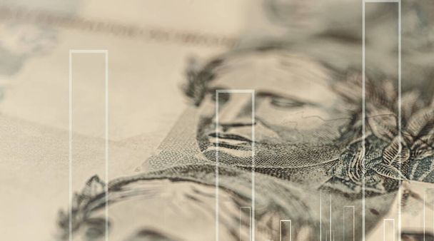 podrobnosti o reálné bankovce, brazilských penězích, spotovém zaměření, obrazu na burze s peněžním texturou a řádky naznačující vzestup a pád, investice nebo ztrátu - Fotografie, Obrázek