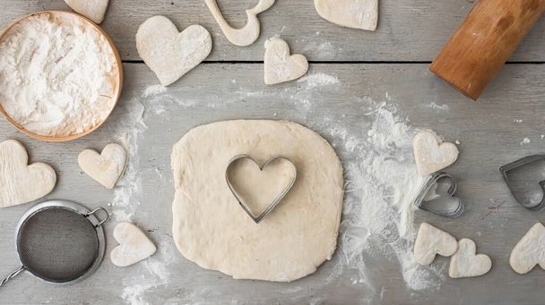 Heart cut from dough. Cooking gingerbread cookies for the holidays: christmas, new year, st. valentine's day, advent. Family bakery. Step by step recipe.  - Photo, Image