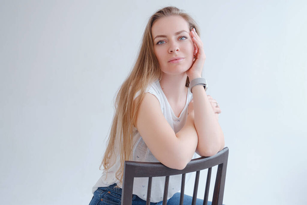 beautiful blonde young woman posing in a photo studio. - Fotó, kép