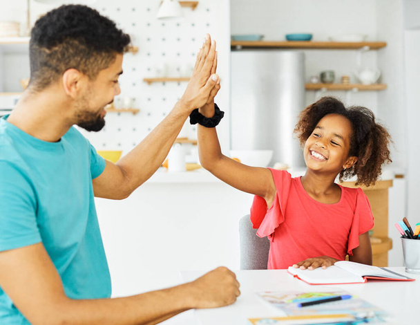 homework teaching girl high five education father children daughter familiy childhood success child african american - Photo, Image