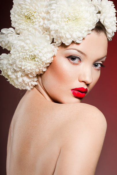 Portrait of the beautiful sweet woman with flowers - Foto, imagen