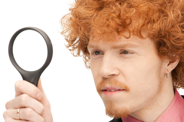 Man with magnifying glass - 写真・画像