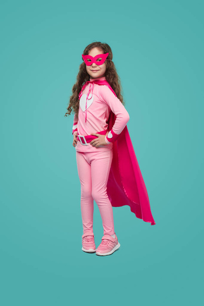 Charming superhero girl in pink costume - Foto, afbeelding