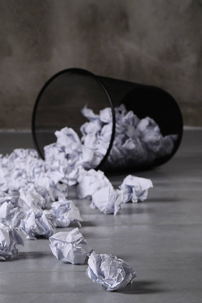 Concept. Creased paper in a trash can - Foto, Bild