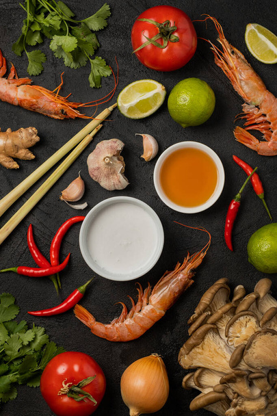 Pattern of ingredients for tom yum soup on a black background - Photo, Image