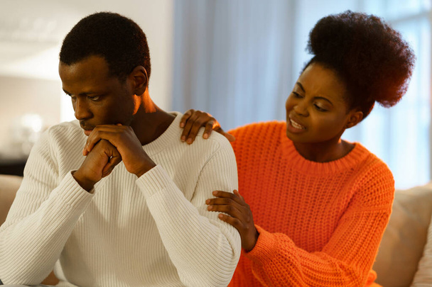Upset african family couple having problems in relationship, discussing breakup or divorce at home - Valokuva, kuva