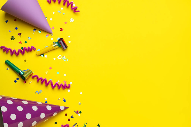 Flat lay composition with party items on yellow background, space for text - Фото, изображение
