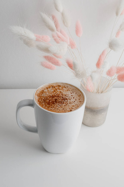 Hot coffee cappuccino in ceramic cup isolated on white background, clipping path included. cappuccino with spices and cinnamon. Cozy morning concept. Hygge. - Φωτογραφία, εικόνα