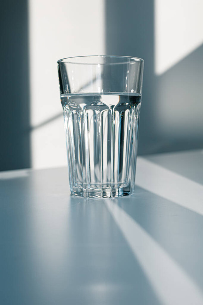 Glass of mineral filtered water and sunshine on white background including clipping path.  - Photo, Image