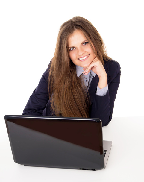 Happy business girl sitting in the workplace - Фото, изображение