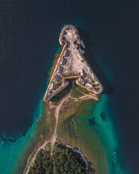 Top down of colorful reef and St. Nicholas Fortress - Sibenik archipelago, Croatia - Фото, зображення