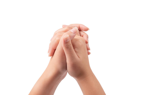 Woman hand gesturing praying,holding hand togerther isolated on white background. - Fotó, kép