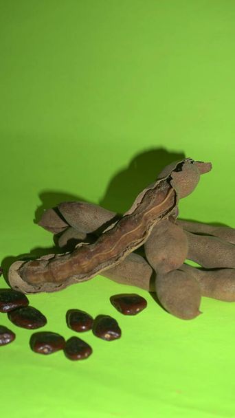 Dried beans and bean pods on green background  - Fotografie, Obrázek