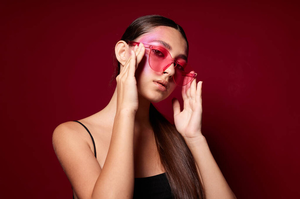 pretty woman bright makeup posing fashion emotions fashion glasses isolated background unaltered - Фото, изображение