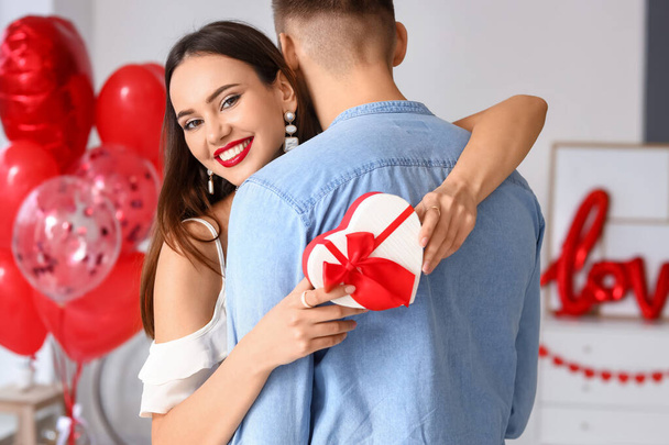 Beautiful young couple celebrating Valentine's Day at home - Foto, immagini