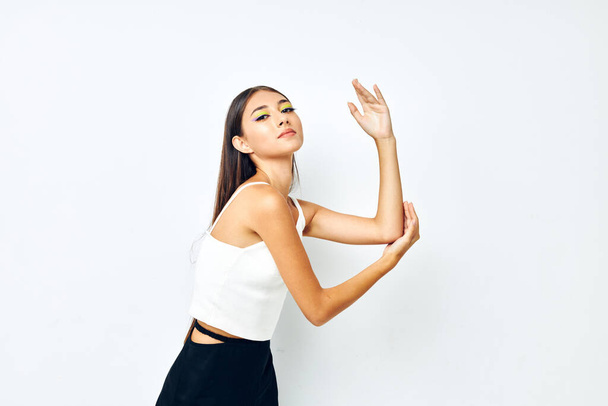 beautiful brunette white t shirt hand gestures charm isolated background unaltered - Foto, immagini