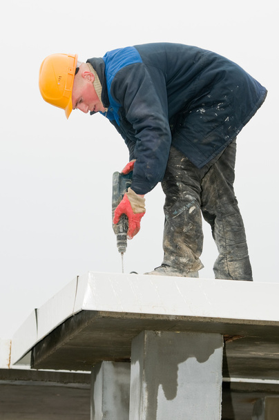 Builder roofer with drill - Φωτογραφία, εικόνα