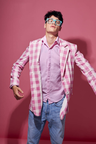 handsome guy fashionable glasses pink blazer posing studio model studio - Foto, immagini