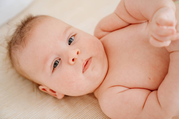 portrait of a cute baby. cosmetics and vitamins for newborns.  - Foto, afbeelding