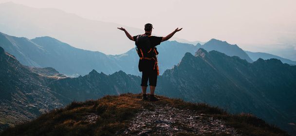 hiker enjoying high mountains view - Fotografie, Obrázek