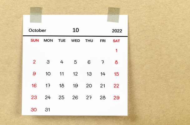 The October 2022 calendar on brown background. - Zdjęcie, obraz