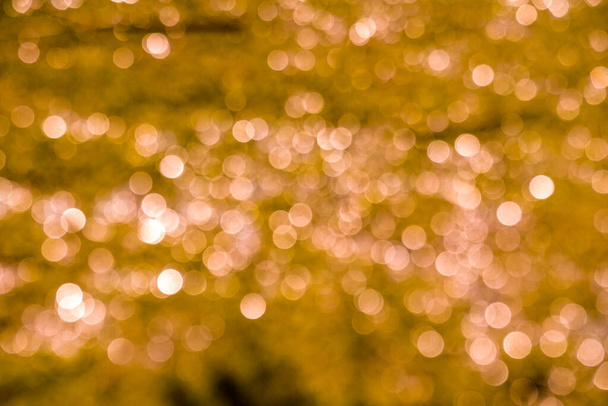 Golden bokhe background with copy space, Merry Christmas and Happy New Year, Holidays greeting with bokeh background                                - Photo, Image