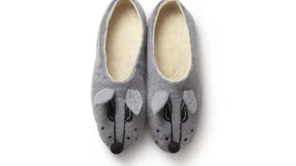 Woman's slippers made of felt on a white background - Footage, Video