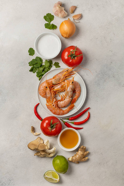 Fresh beautiful ingredients for delicious tom yum soup on a light background - Фото, зображення