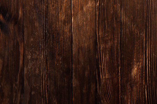 Vintage brown wood background texture with knots and nail holes. Old painted wood wall. Wooden dark horizontal boards - Foto, imagen