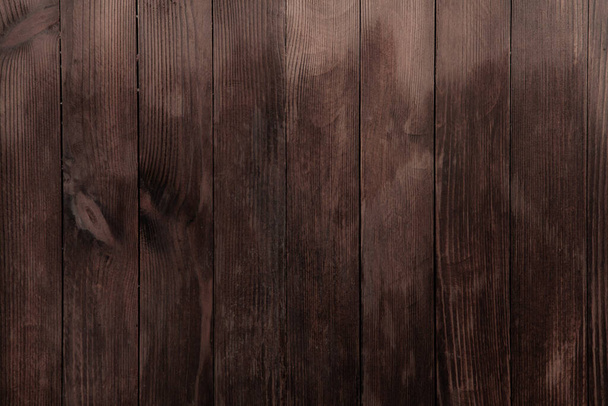Texture de fond en bois marron vintage avec nœuds et trous d'ongles. Vieux mur en bois peint. Panneaux horizontaux sombres en bois - Photo, image