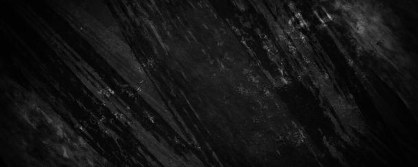 cemento negro granulado y fondo desenfocado con grietas grises oscuras y arrugas arrugadas - Foto, imagen