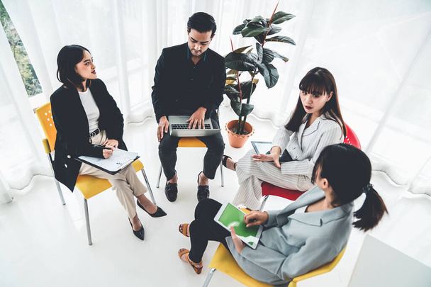 Business people proficiently discuss work project while sitting in circle - Фото, зображення