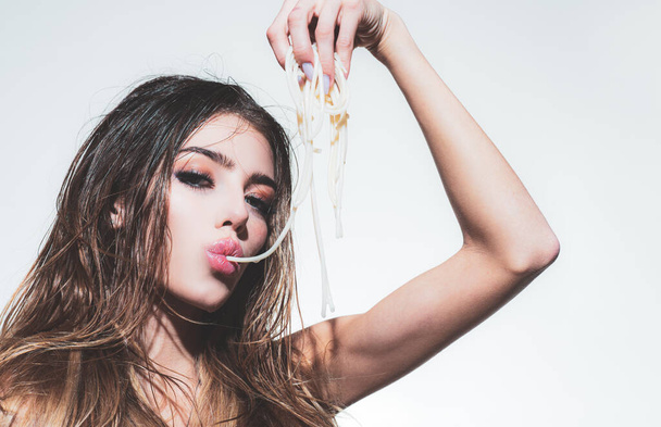 Young woman eating tasty italian pasta, spaghetti. - Fotoğraf, Görsel