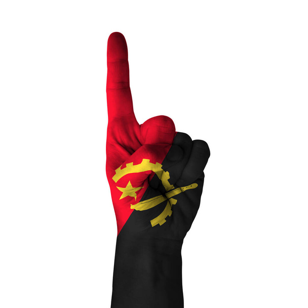 Ręcznie skierowany kciuk w górę, angola malowana flagą jako symbol w górę, pierwszy i pierwszy symbol - odizolowany na białym tle - Zdjęcie, obraz