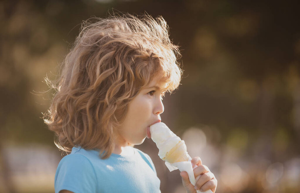 Kids eating ice cream portrait, cute child. - Foto, afbeelding