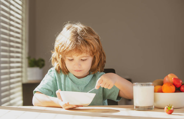 Child eating healthy food. Cute little boy having soup for lunch. Healthy nutrition for kids. - Φωτογραφία, εικόνα