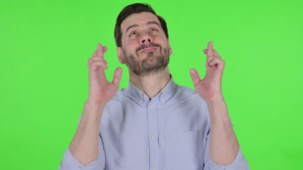 Portrait of Man Praying with Fingers Crossed, Green Screen - Imágenes, Vídeo