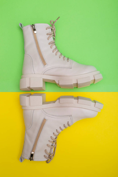 Female winter boots on high soles on a colored background, top view - Photo, Image