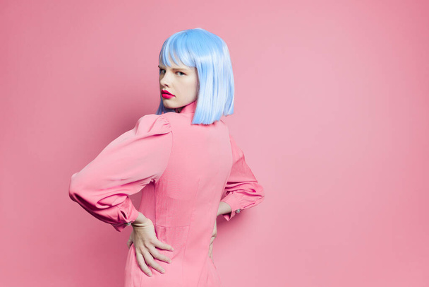 glamorous woman wearing a blue wig psing on  isolated background. High quality photo - Fotografie, Obrázek