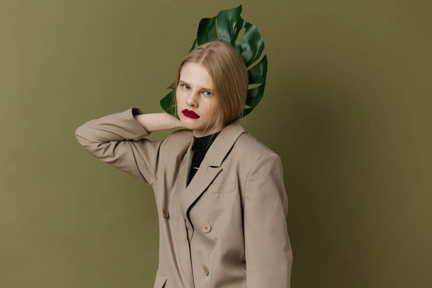 glamorous woman with  red lips with  palm leaf on  isolated background. High quality photo - Valokuva, kuva