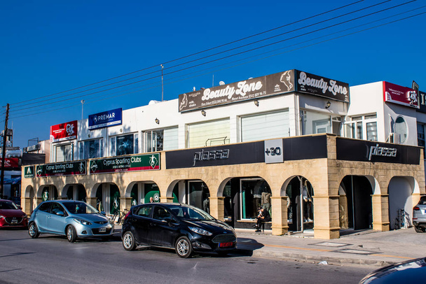 Famagusta, Northern Cyprus - January 07, 2022 Cityscape in the heart of Famagusta, Turkish part of Northern Cyprus, shops, stores and architecture of new buildings in the streets of Famagusta city - Photo, Image
