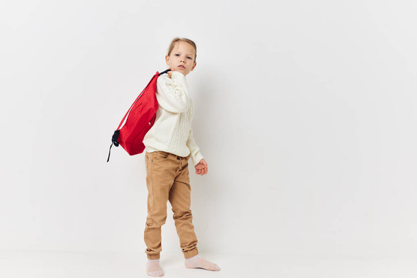 pretty young girl school red backpack posing isolated background - 写真・画像