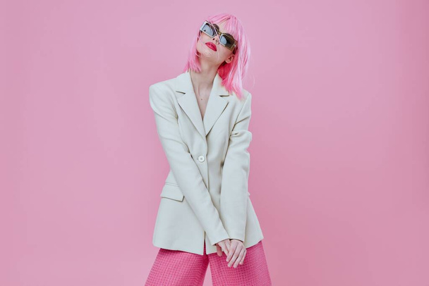 Portrait of a charming lady wearing sunglasses with  pink hair posing. High quality photo - Φωτογραφία, εικόνα