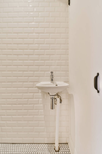 Adorable washbasin with white tiled walls - Photo, Image