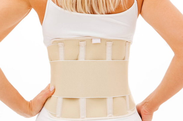 Orthopedic lumbar support products. Lumbar Support Belts. Posture Corrector For Back Clavicle Spine. Lumbar Waist Support Belt Strong Lower Back Brace Support. Pregnant and Postnatal Lumbar brace. Back view - Photo, Image