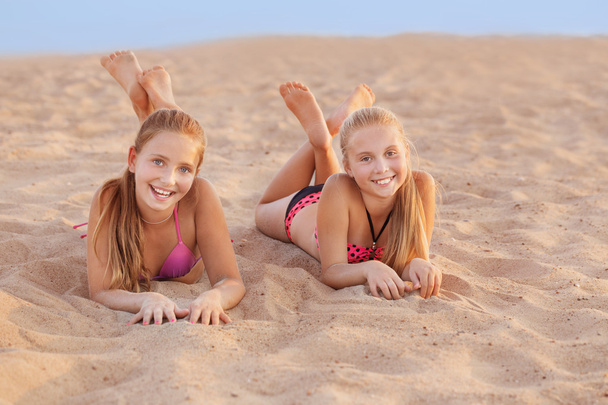 two happy girls on the beach - Фото, зображення