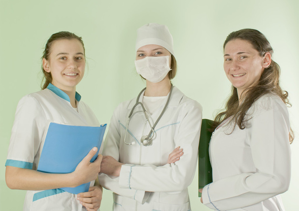 Three lady doctors staying indoors - Fotó, kép