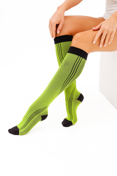 Medical Compression Stockings for varicose veins and venouse therapy. Compression Hosiery. Sock for sports isolated on white background - Photo, Image