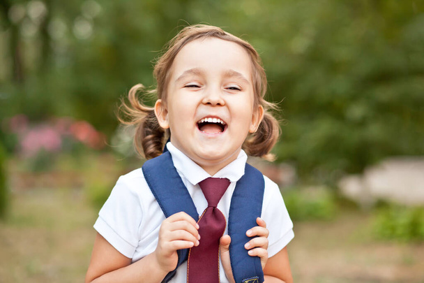 little cute schoolgirl in uniform with school bag backpack - Foto, Imagem